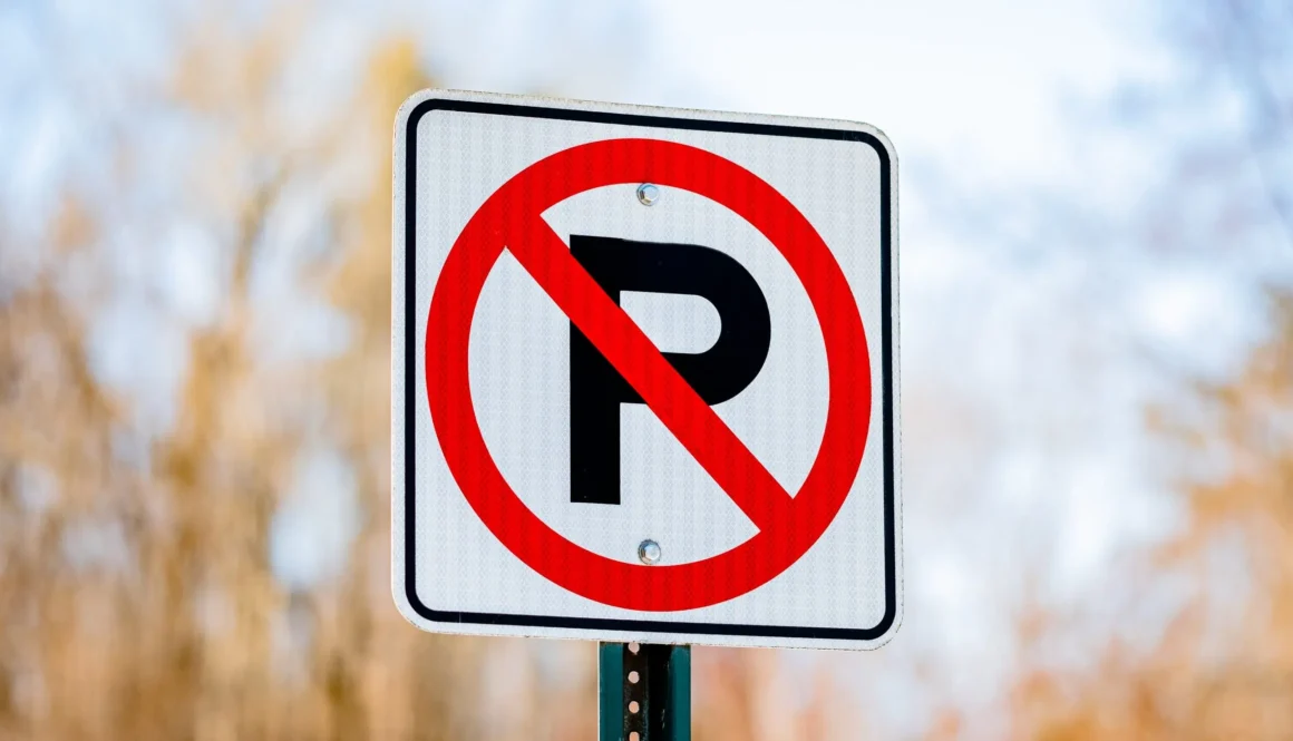 red and white no parking sign