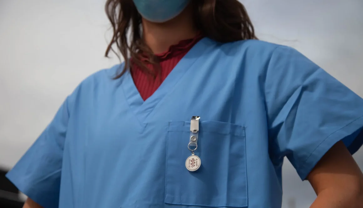 woman in red shirt wearing blue goggles