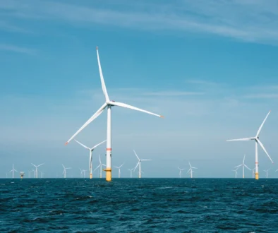 a group of wind turbines in the ocean