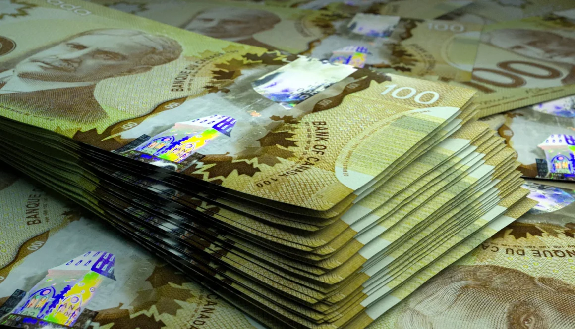 Money of Canada. Canadian dollar bills. CAD banknotes. 100 dollars. Business, finance, news background.