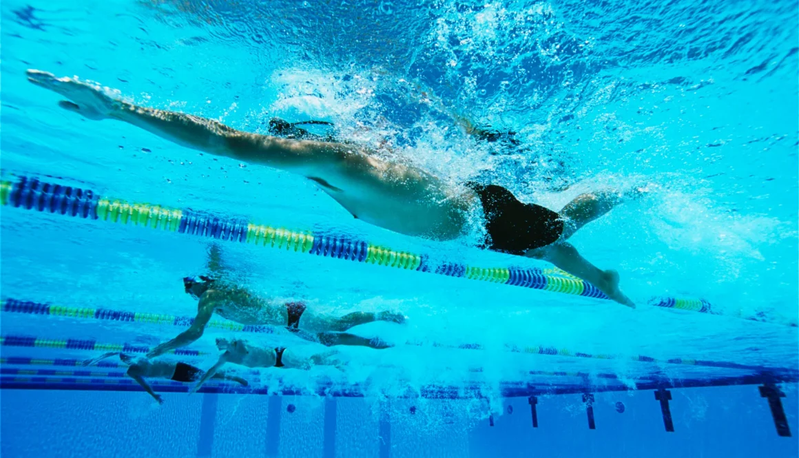 Swimmers Swimming Together In A Line During Race