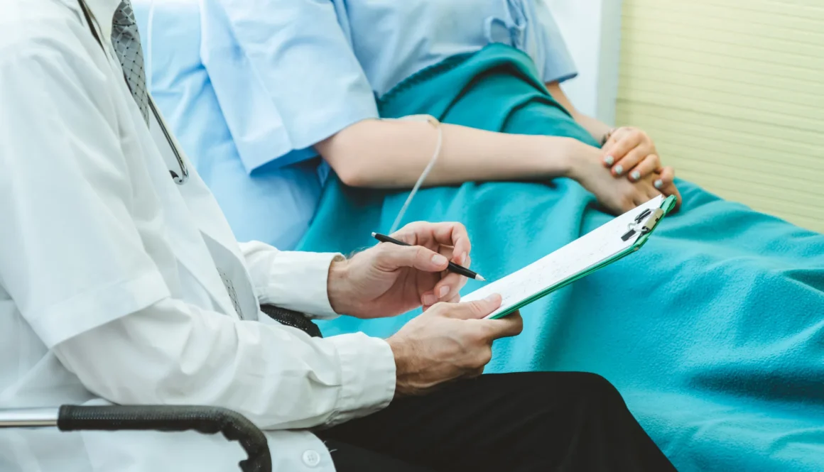 Doctor in professional uniform examining patient at hospital or medical clinic. Health care , medical and doctor staff service concept.