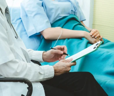 Doctor in professional uniform examining patient at hospital or medical clinic. Health care , medical and doctor staff service concept.