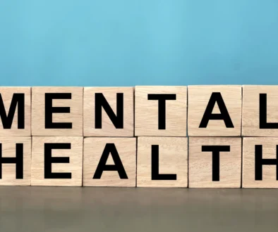 Mental health text written on wooden lettering, psychology well-being concept