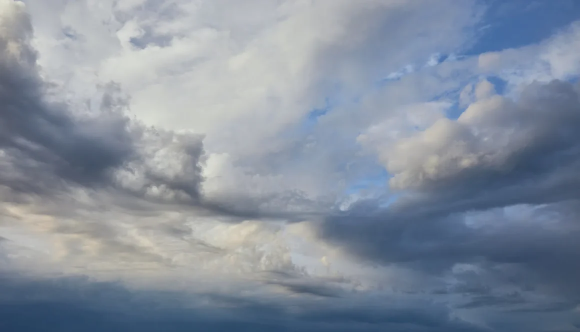 view of peaceful grey sky background with white and dark clouds