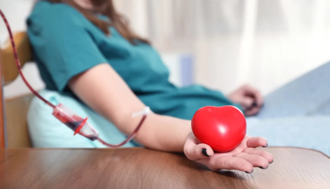 Teenager donating blood in hospital, closeup view