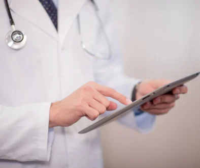 Doctor using digital tablet