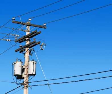 Power line post and blue sky