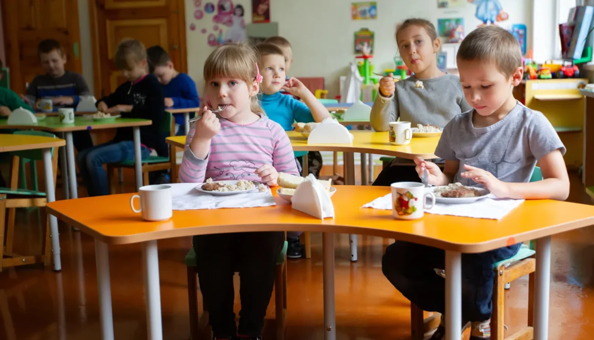 September 14, 2017. Belarus. Minsk. An open day at the kindergarten. A group of children are eating in kindergarten.
