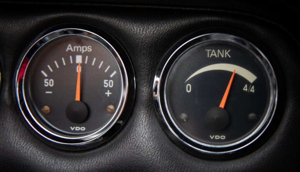 a close up of two gauges in a car