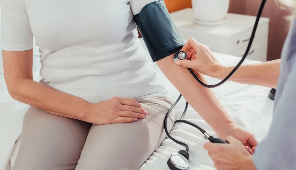nurse measuring blood pressure to patient