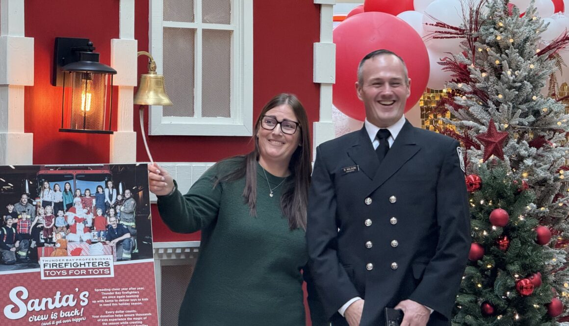 Jill Thompson, Chair of Christmas Cheer, and Rob Wilson, Chair of Toys for Tots, ring a bell to celebrate the launch of their annual fundraiser. (Sam Goldstein/November 21, 2025)