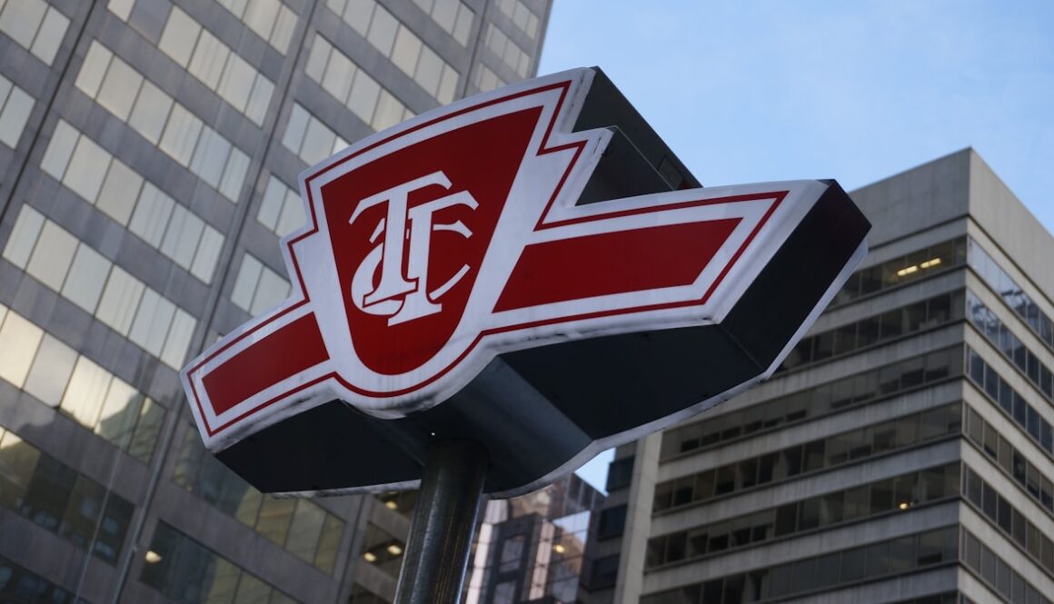 a close up of a street sign with a building in the background