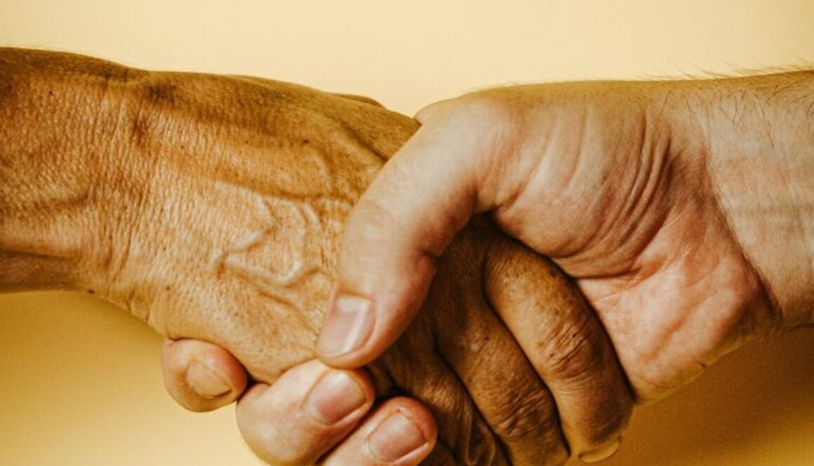 person holding babys hand