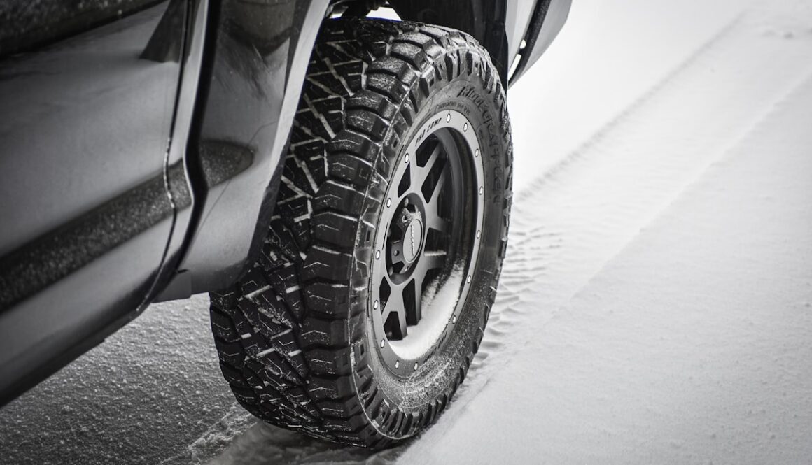 grayscale photo of car wheel