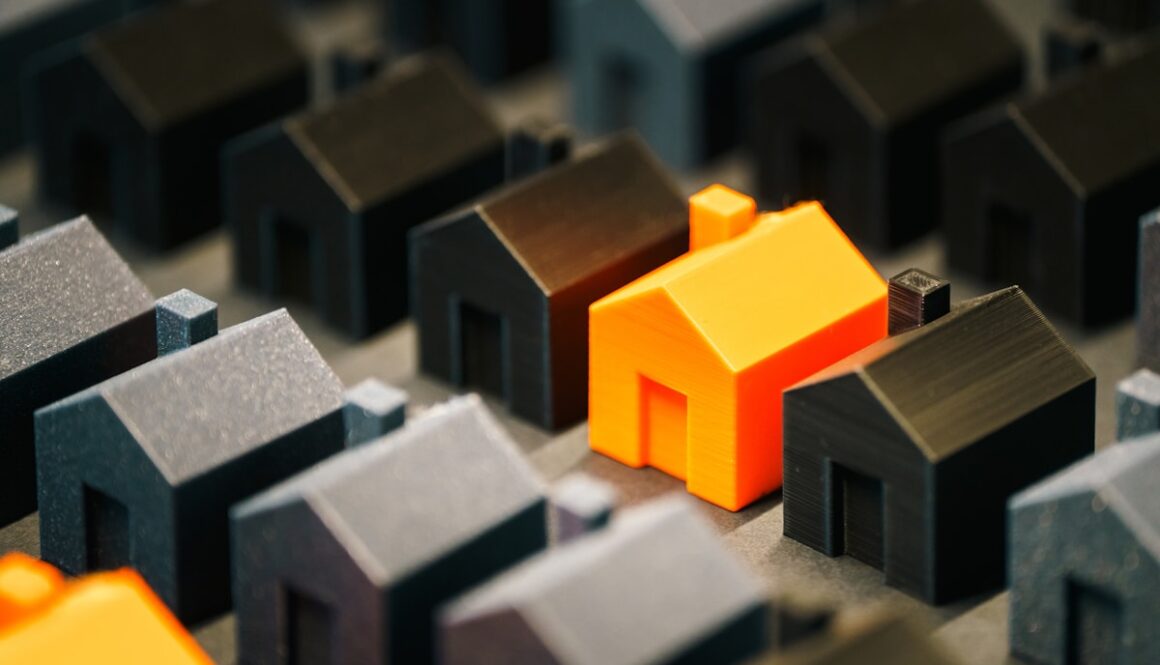 A single, bright house stands out from the rest.