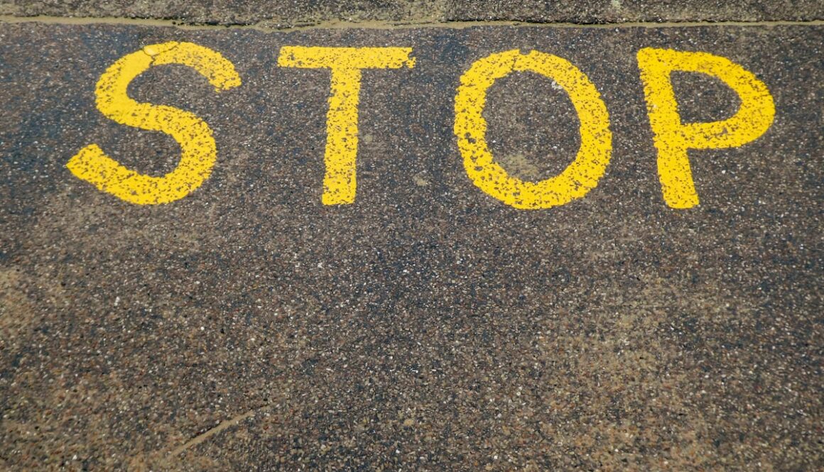 black and yellow love print on gray concrete floor