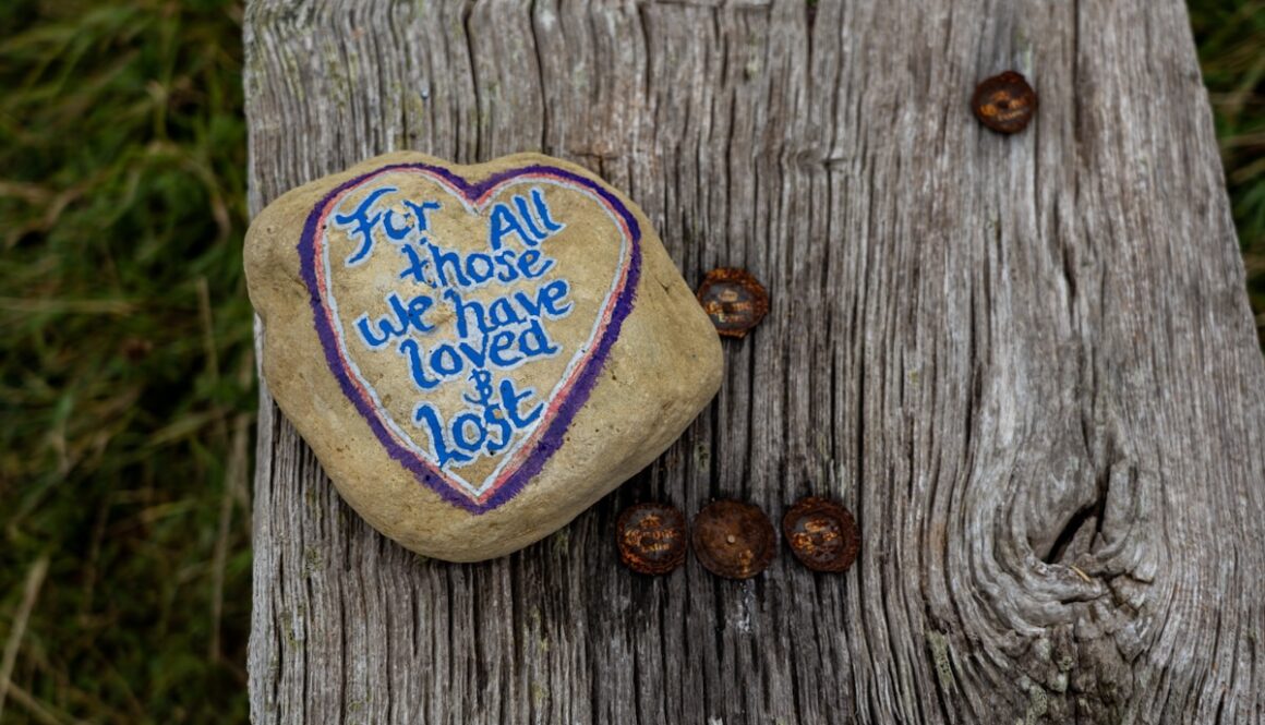 a heart shaped rock with a message written on it