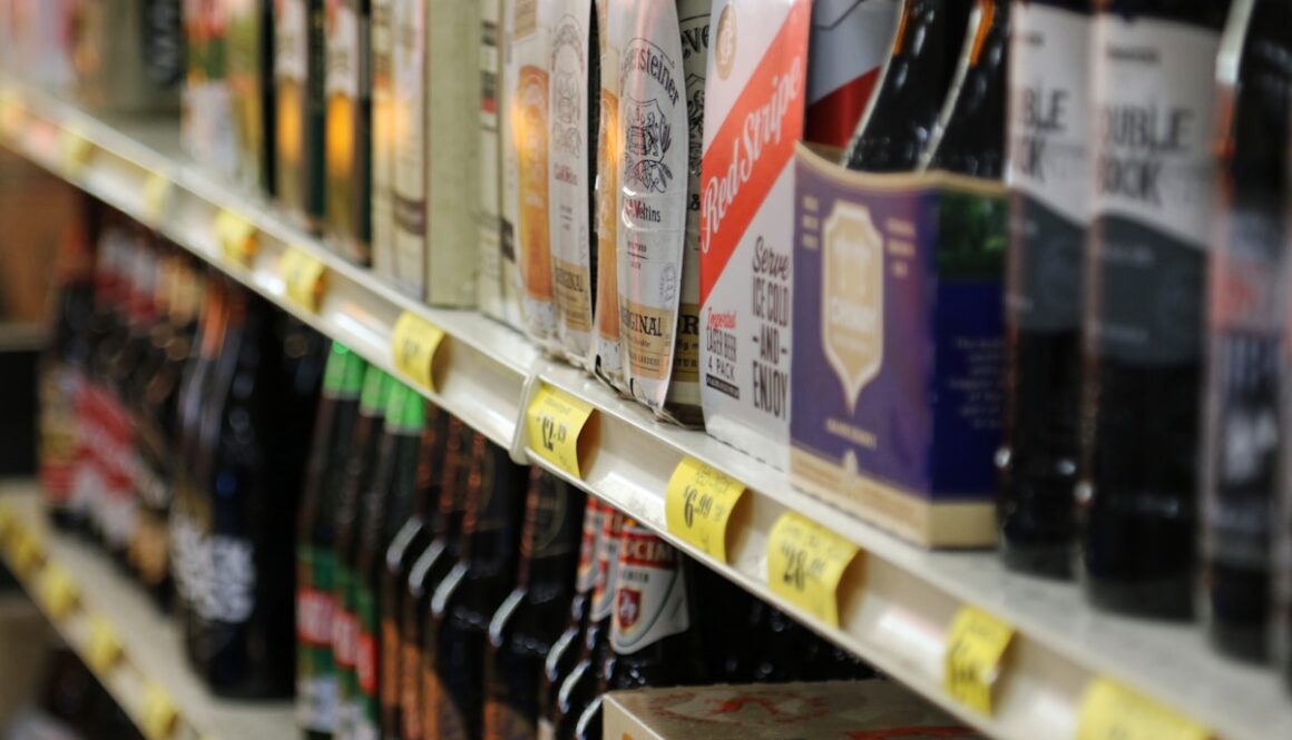 Bottles and boxes of beverages on a store shelf