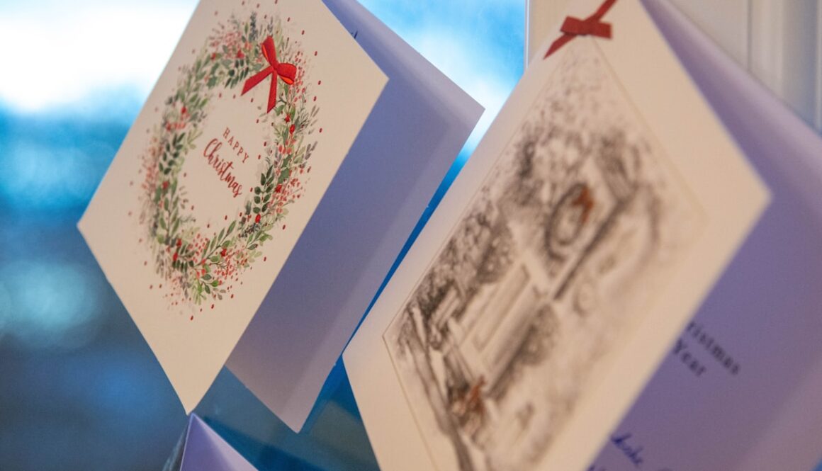 a close up of two cards on a window sill