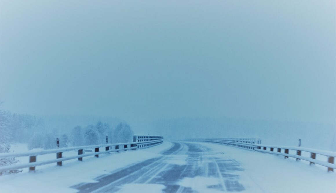snow covered empty road