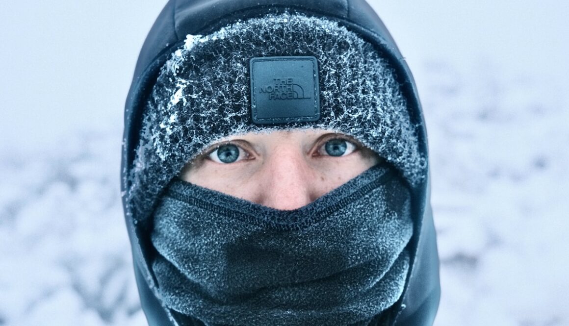 Person in winter clothing with frost on face