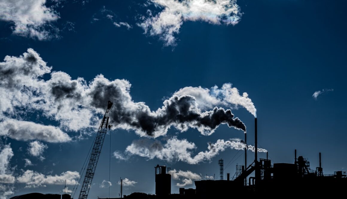 a factory with smoke coming out of it's stacks