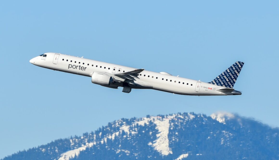 An airplane is flying over a mountain range