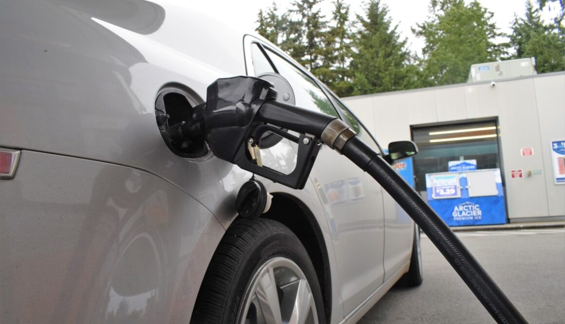 an electric car being charged at a gas station