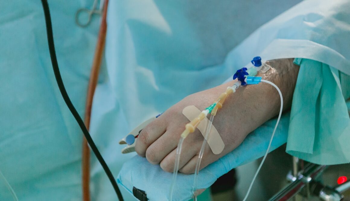 a person in a hospital bed with an iv