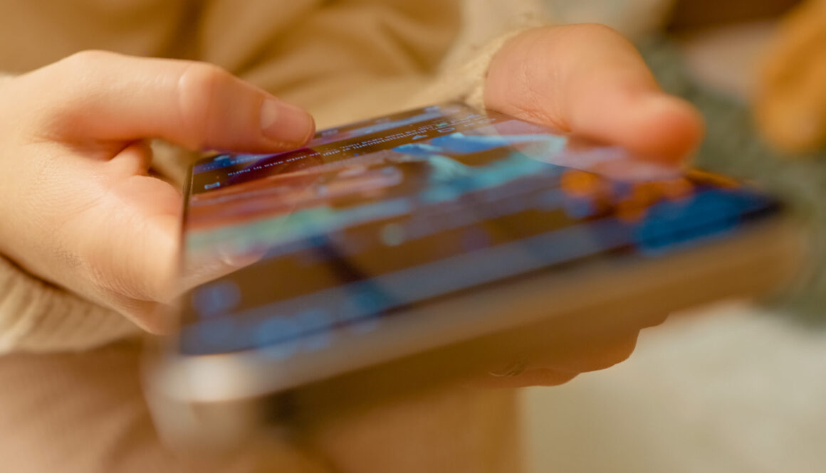 Female navigating digital platform with focused thumb movements