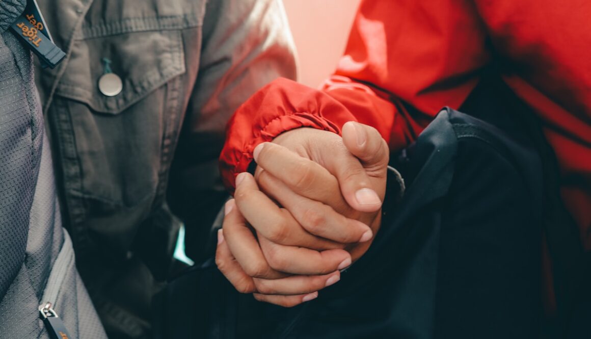 man and woman holding hands