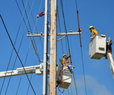 two linemen on cherry pickers