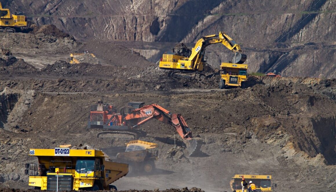 photography of excavators at mining area