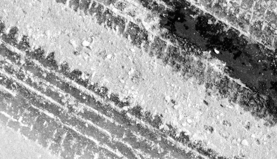 grayscale photo of concrete road