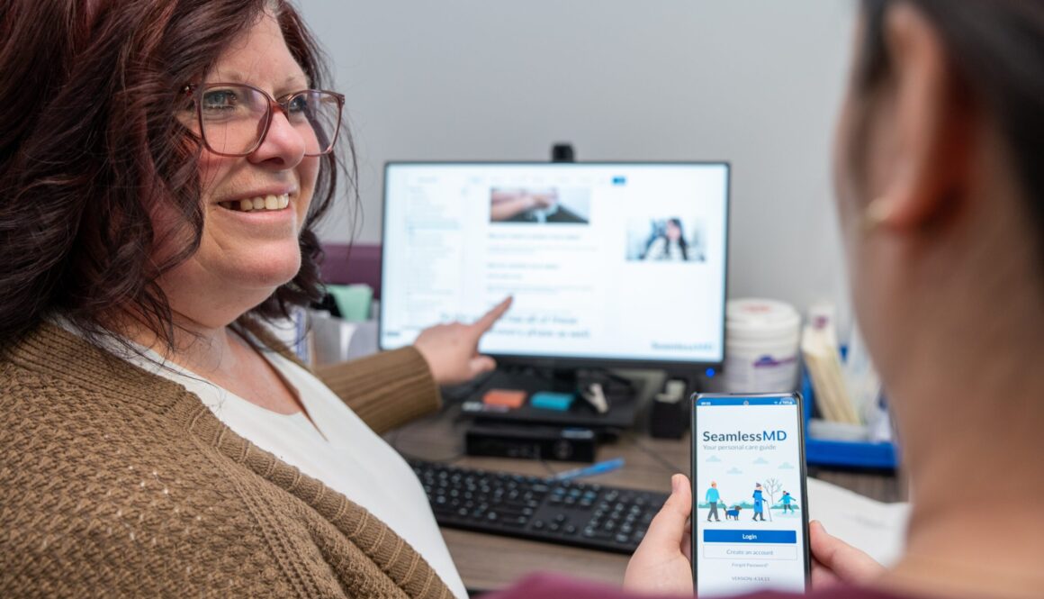 Two people discussing SeamlessMD