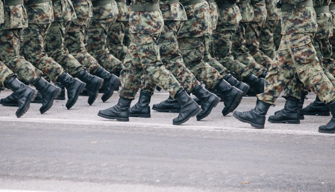 men in green and brown camouflage uniform
