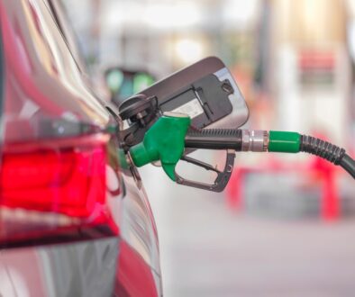 a gas pump is connected to a car at a gas station