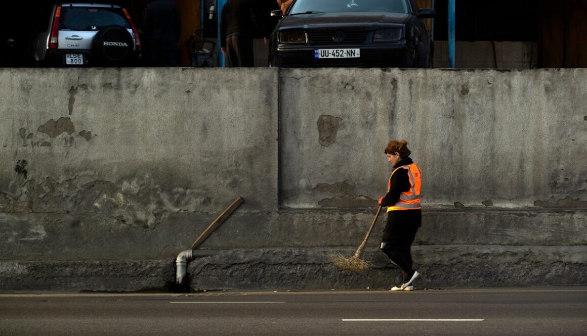 woman cleans the street