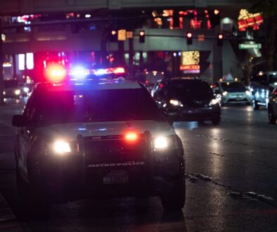 black car on road during night time