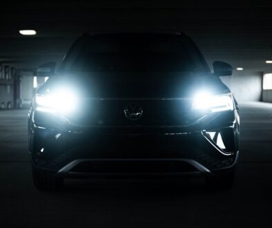 the front of a black car in a parking garage