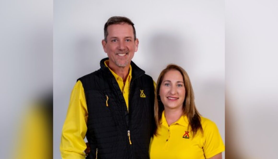Married couple poses for a picture