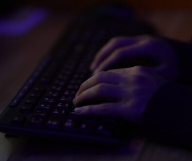 persons hand on black computer keyboard
