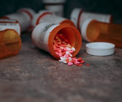 a close up of a bottle of pills on a table