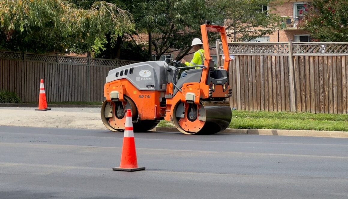 a man on a street working on a road
