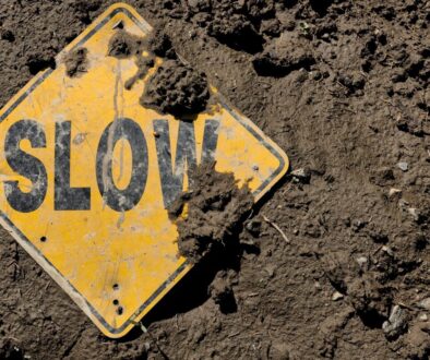a yellow sign on the ground