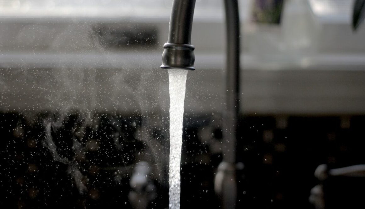 a faucet running water from a kitchen sink