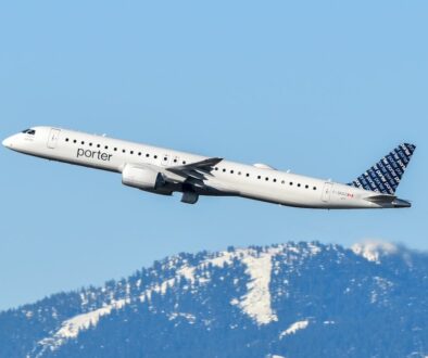 An airplane is flying over a mountain range