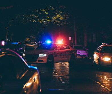 A couple of police cars parked in a parking lot